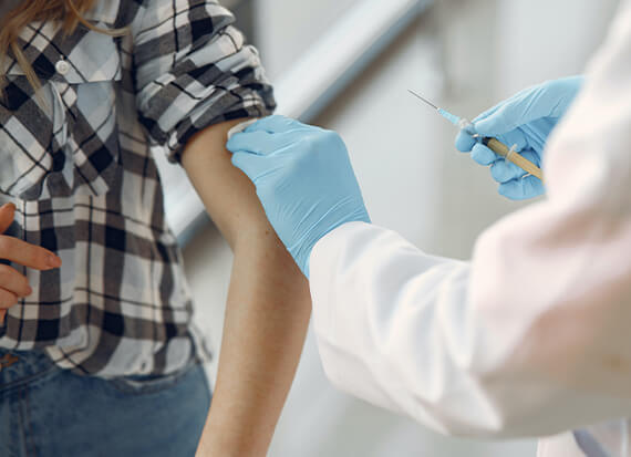 a nurse administers a free covid vaccination.